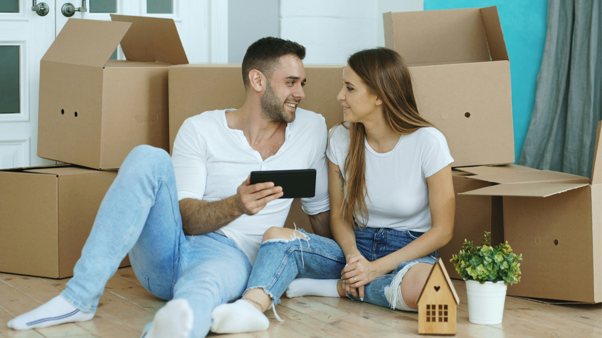 Couple packing and moving with sturdy cardboard boxes